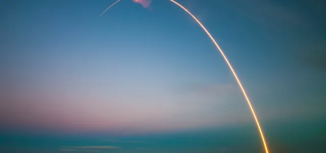 rocket launch light trail at dusk by SpaceX courtesy of Unsplash.